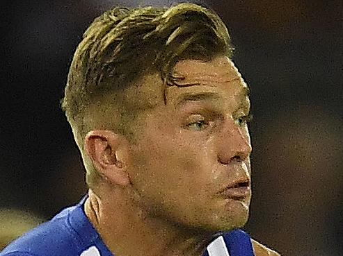 Shaun Higgins of the Kangaroos (left) and Ryan Burton of the Hawks are seen moments before they collide during the Round 5 AFL match between the North Melbourne Kangaroos and the Hawthorn Hawks at Etihad Stadium in Melbourne, Sunday, April 22, 2018. (AAP Image/Julian Smith) NO ARCHIVING, EDITORIAL USE ONLY