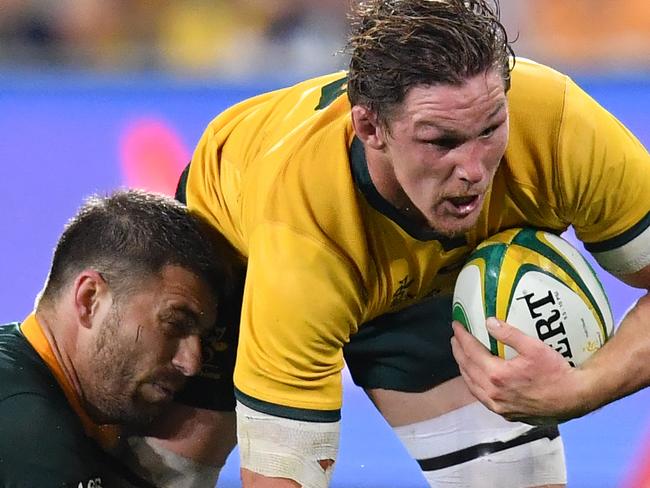 Michael Hooper (right) of the Wallabies is tackled by Willie Le Roux (left) of the Springboks during the Rugby Championship match between Australia and South Africa at Suncorp Stadium in Brisbane, Saturday, September 8, 2018. (AAP Image/Darren England) NO ARCHIVING, EDITORIAL USE ONLY