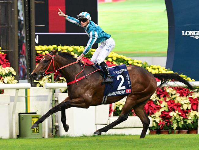 James McDonald celebrates as Romantic Warrior wins the Group 1 Hong Kong Mile. Picture: Grant Peters-Trackside Photography.