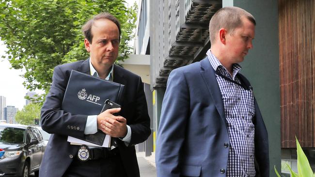 Australian Federal Police officers outside the AWU offices in Melbourne. Picture: Aaron Francis