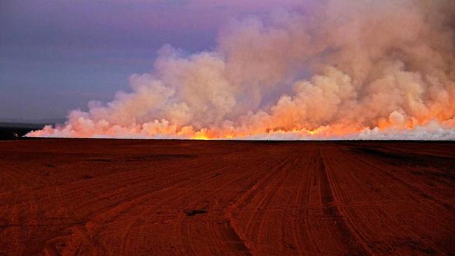 FARM FLAMES: NewsMail photographer Mike Knott took these photos of a cane fire on Windermere Rd, Qunaba. Picture: Mike Knott BUN300719FIRE1