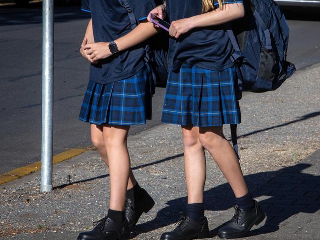 ADELAIDE, AUSTRALIA - NewsWire Photos JANUARY 30, 2023: Non-identifying images of school children entering an Adelaide High School on the first day of the 2023 School year. South Australia is bringing in a controversial new smart phone and smart watch ban for students. Picture NCA NewsWire / Emma Brasier