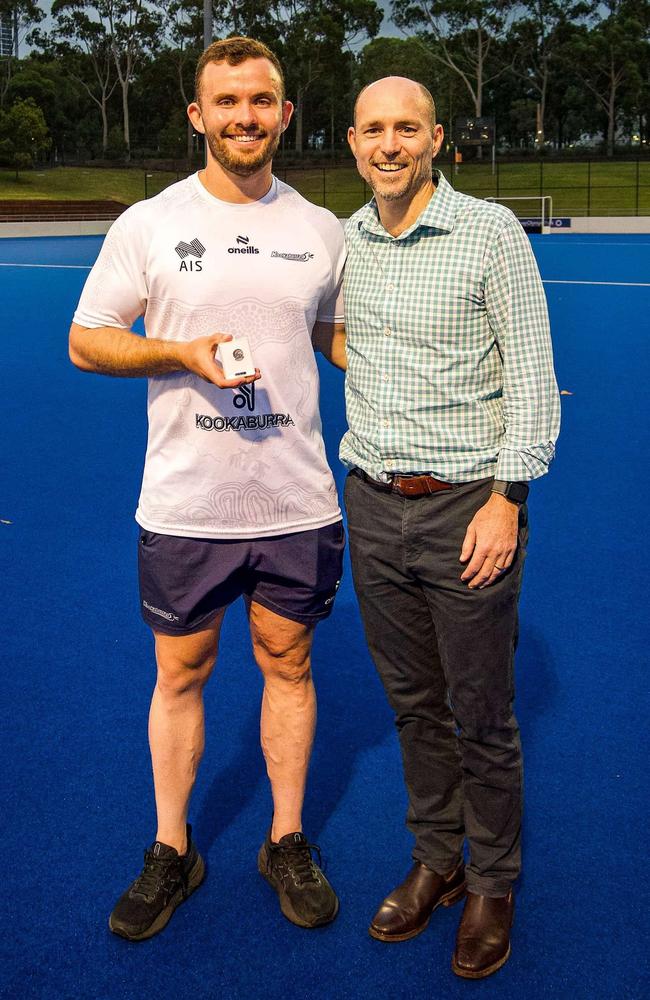 Townsville junior Mitch Nicholson made his national debut for the Kookaburras against Spain. Pictured being presented his player pin by Max Diamond also a Townsville junior and Kookaburra No. 310. Picture: Townsville Hockey Association Facebook