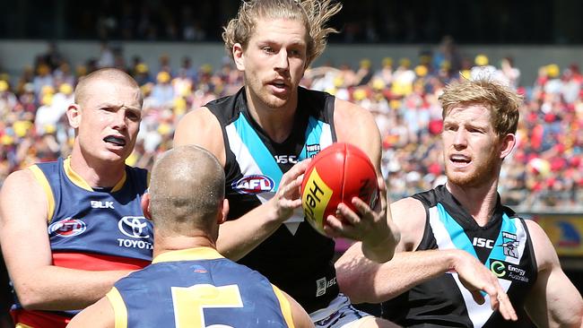 Aaron Young marks ahead of Sam Jacobs, Scott Thompson and Matthew Lobbe. Picture: Sarah Reed.