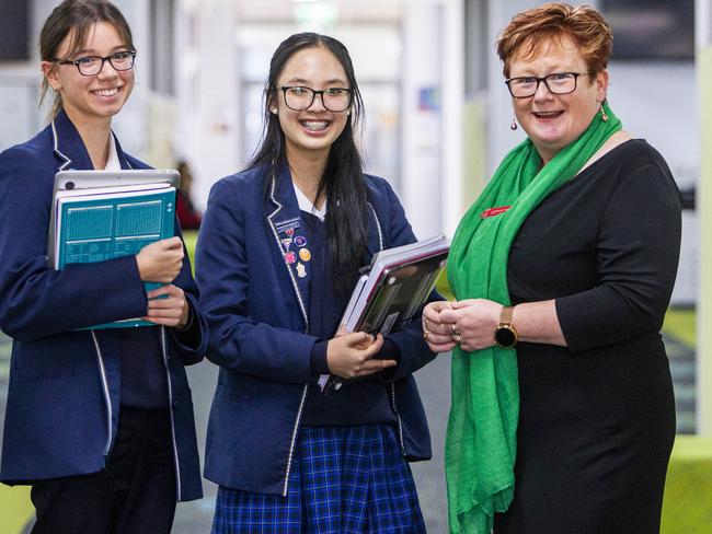 Avila College principal Dr. Michelle Cotter with students (L-R) Julia Augustyn and Linh Nguyen. Picture: Aaron Francis/The Australian