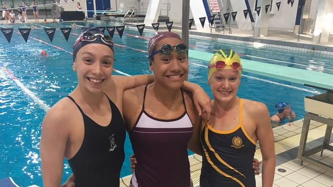 Sophie Martin, Claveria Johnson-Tiamalu and Tiana Kritzinger after a podium finish at a QGSSSA meet. All starred at the All Ages.