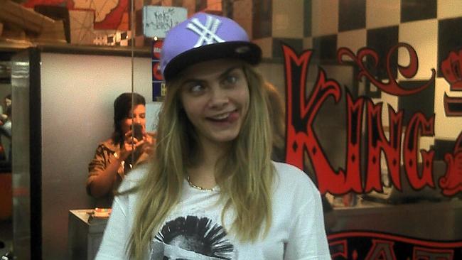 She loves her ink: Cara hits up a tattoo studio in Rio de Janeiro. Picture: Splash News