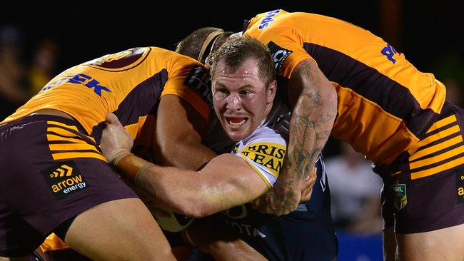 Glenn Hall wrapped up by the Broncos defence. Picture: Evan Morgan