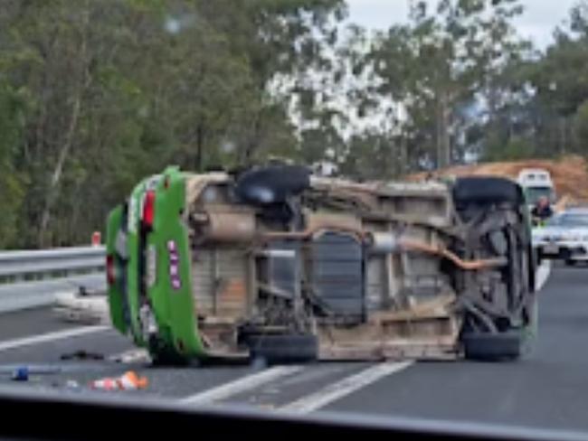 A ‘Jucy’ campervan has rolled on its side following a two vehicle crash, closing the Bruce Highway.