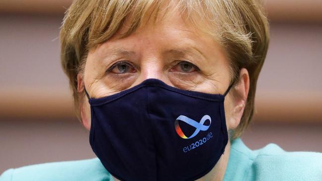 German Chancellor Angela Merkel wears a protective face mask with the logo of Germany's EU council presidency. Picture: AFP