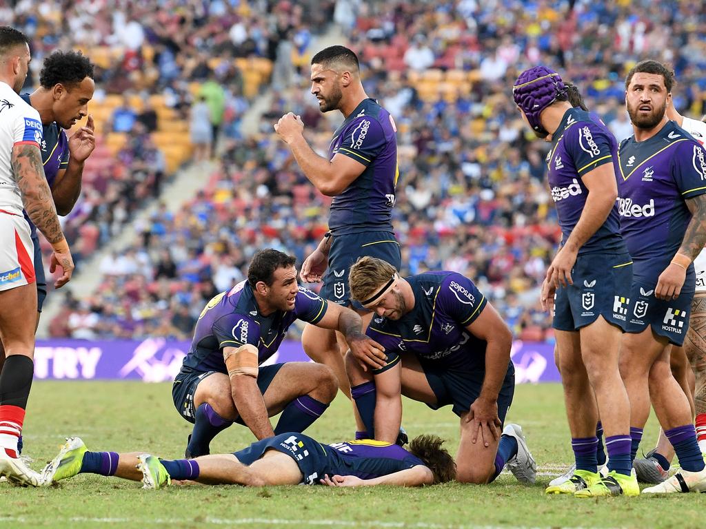 Ryan Papenhuyzen lies flat on the ground after copping a high hit. Picture: Bradley Kanaris/Getty Images