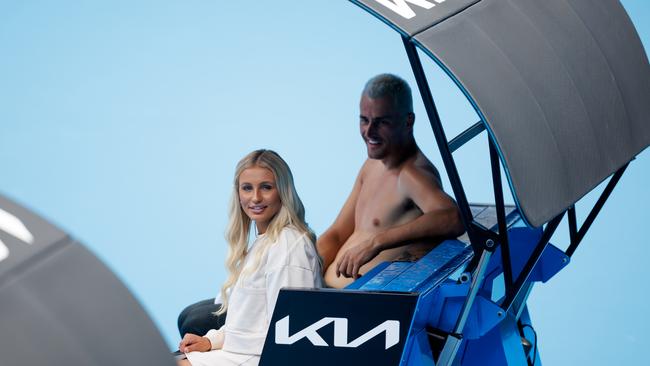 Bernard Tomic sits with Keely Hannah who watched court side as he practised at Melbourne Park last Friday. Mark Peterson/TENNIS AUSTRALIA