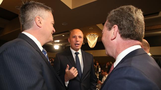 Ministers Mathias Cormann, Peter Dutton and Christopher Pyne talking before PM Malcolm Turnbull addresses the National Press Club in Canberra. Picture Kym Smith