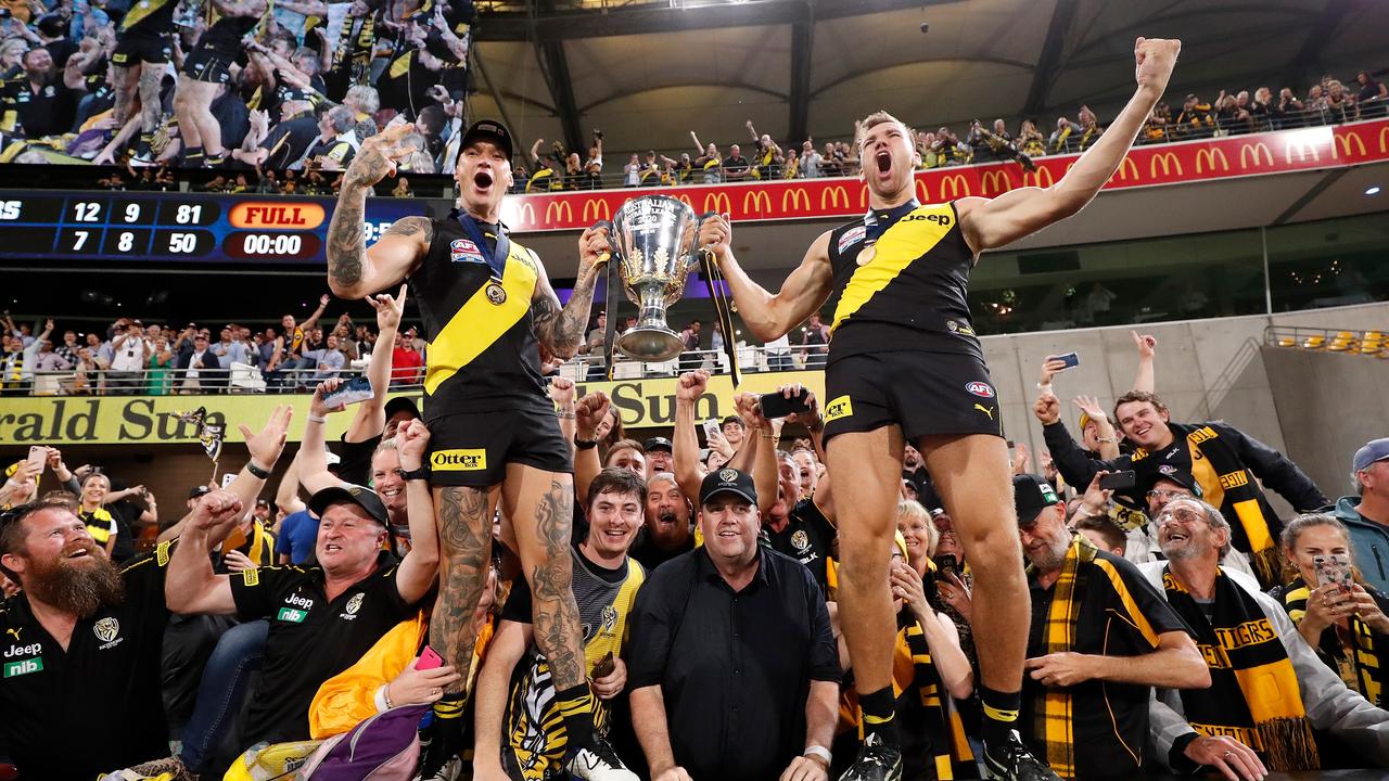 Tigers Dustin Martin (left) and Noah Balta savour their historic AFL grand final victory at the Gabba. Picture: Michael Willson/AFL Photos via Getty Images