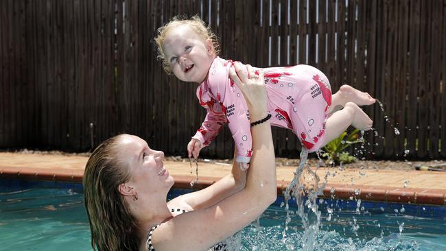 Hannah Dawson posing with daughter Sumaya, 1, in their pool. Picture: AAP/Josh Woning)