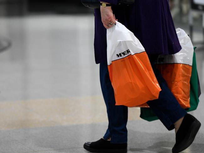 A shopper is seen with shopping bags from a Myer department store, which was recently shut due to an outbreak of coronavirus (COVID-19), in Sydney, Friday, May 22, 2020. Myer will trial the opening of a further 9 stores from Friday 22nd May. (AAP Image/Bianca De Marchi) NO ARCHIVING