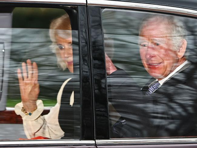 King Charles III and Queen Camilla wave as they leave by car from Clarence House in London last week. Picture: AFP