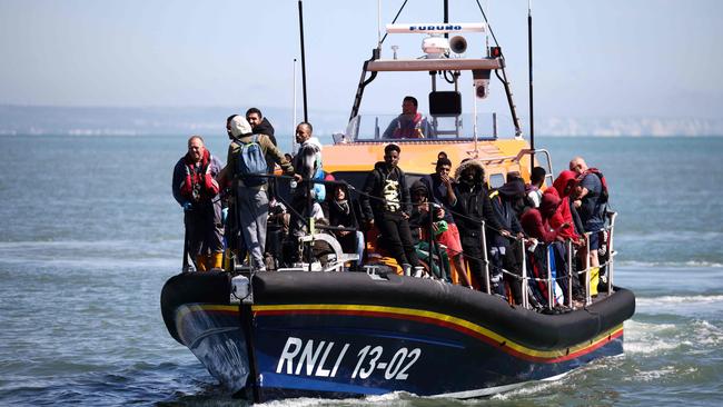 Migrants aboard of a Royal National Lifeboat Institution lifeboat after being picked up at sea while crossing the English Channel from France. Picture: Henry Nicholls/AFP
