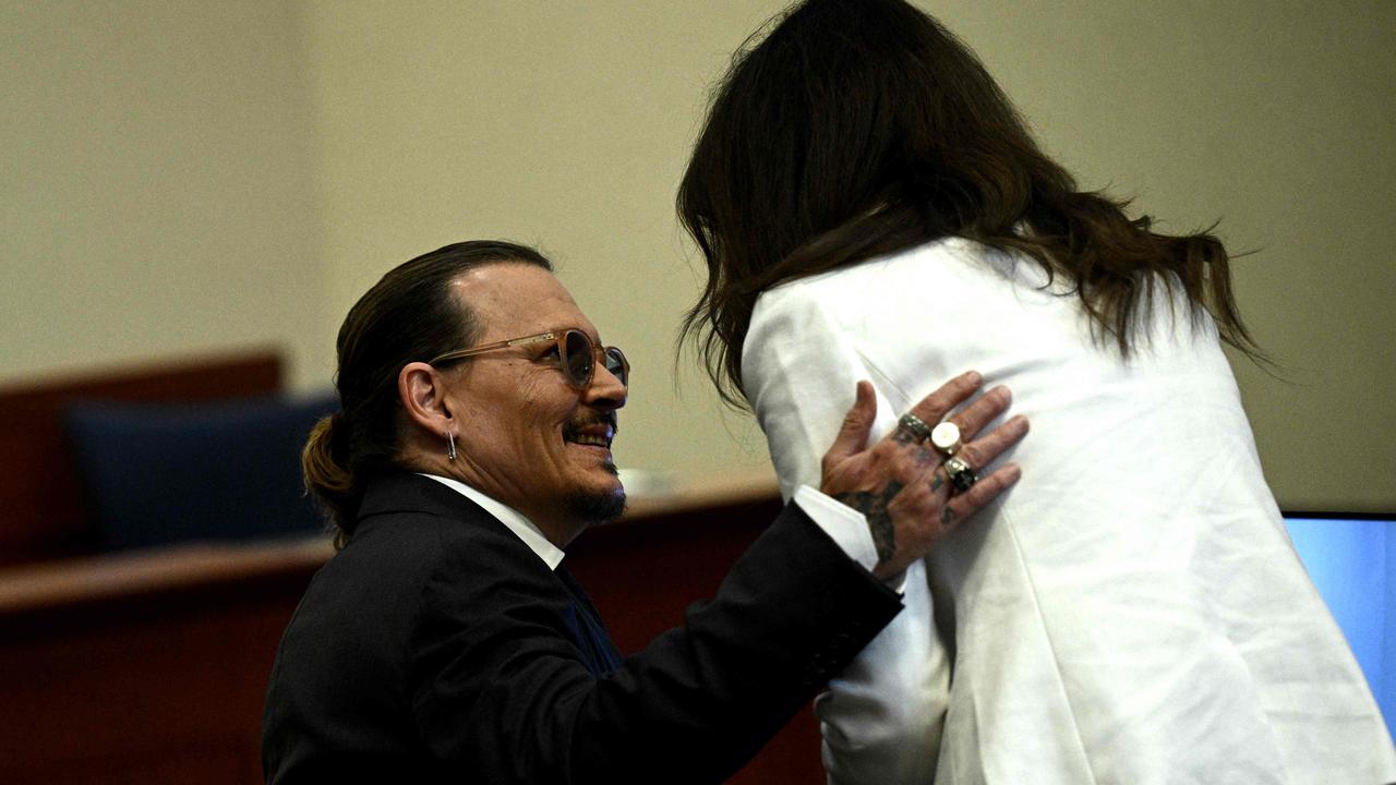 Johnny Depp and Camille Vasquez: ‘It looks flirtatious but that’s probably the point.’ Picture: Brendan Smialowski/AFP