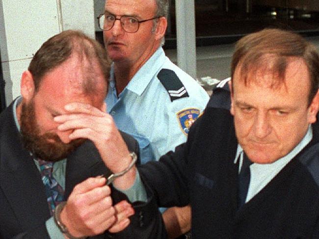 Paul Offer in handcuffs at the Supreme Court in Sydney where he was found guilty of one count of murder, attempted & soliciting to murder four others.