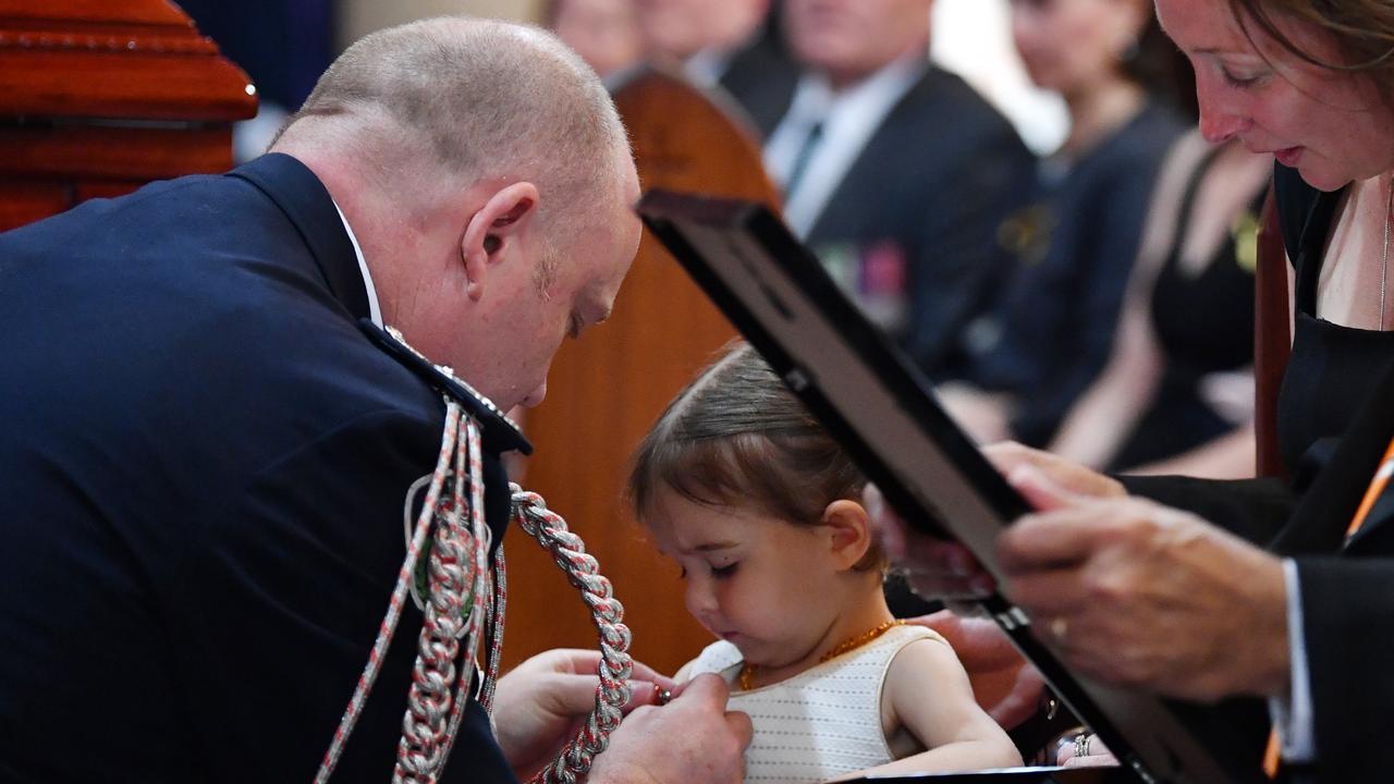 Charlotte O'Dwyer received her father’s service medal. Picture: Dean Lewins/AAP