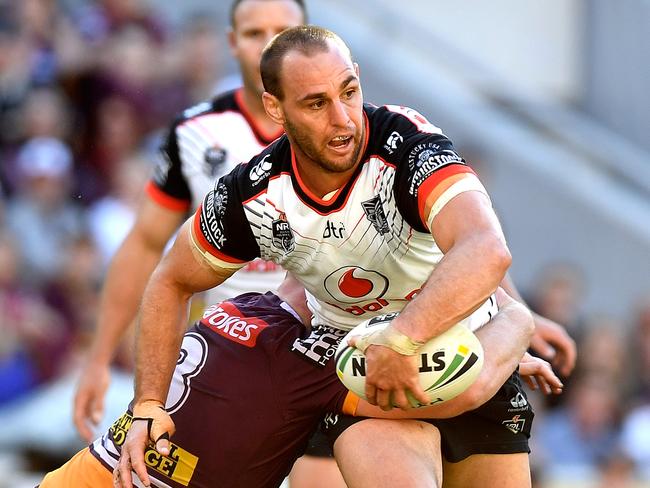 Simon Mannering of the Warriors is tackled during the round 18 NRL match between the Brisbane Broncos and the New Zealand Warriors at Suncorp Stadium. Picture: Getty Images