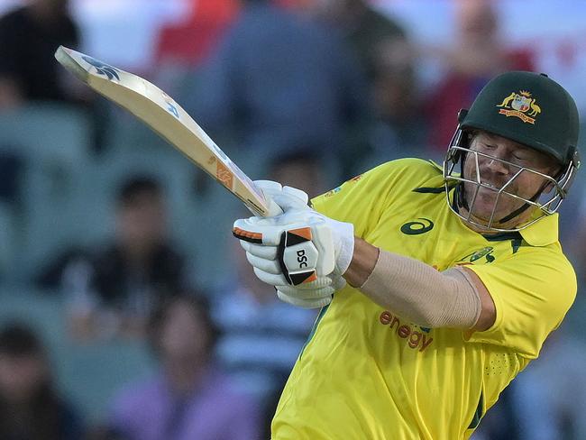 Australia's David Warner plays a shot during the first one-day international (ODI) cricket match between Australia and England at the Adelaide Oval on November 17, 2022 in Adelaide. (Photo by Brenton Edwards / AFP) / -- IMAGE RESTRICTED TO EDITORIAL USE - STRICTLY NO COMMERCIAL USE --