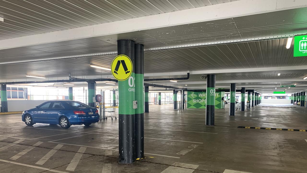 While supermarkets were full the public seemed to be staying away from shopping centres, as seen by this near-empty car park at Chermside Shopping Centre. Picture: Brad Fleet