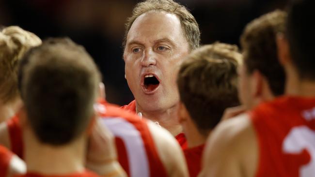 John Longmire addresses his players during the loss to Essendon.