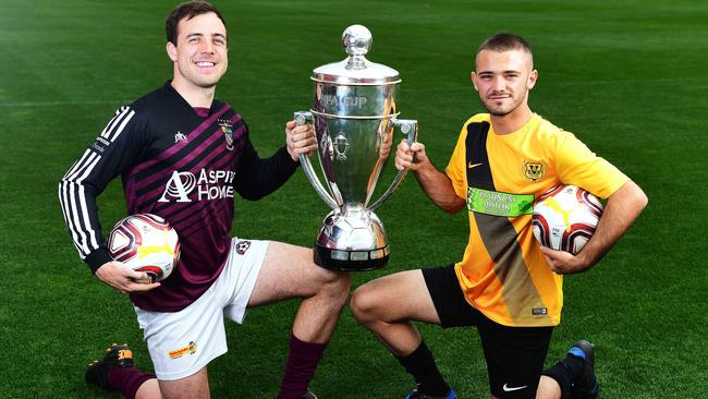 Elizabeth Vale’s Jimmy Greaves, pictured right, alongside Elizabeth Downs player Matt Watson, scored a hat-trick in his side’s 21-0 Challenge Cup amateur soccer thrashing of Strathalbyn on Sunday. Downs beat Hahndorf 22-0 in 2017. Picture: Mark Brake