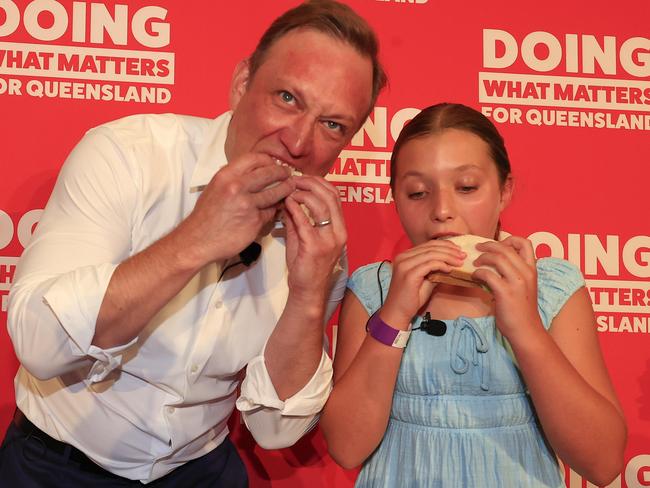 Premier Steven Miles holds his party launch at the North Lakes Community Centre. Premier Miles makes a sandwich with his daughter Bridie 10 on stage. Pics Adam Head