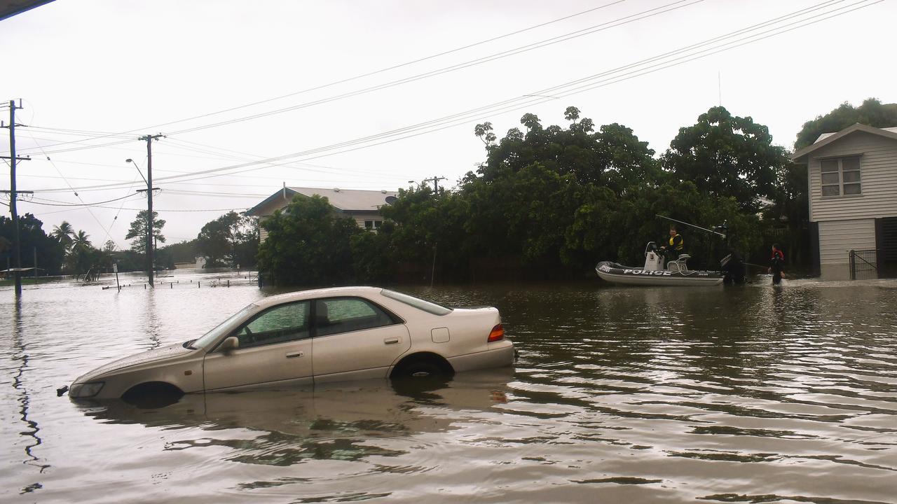 A Queensland Police Service rescue boat navigating floodwaters on the inundated intersection of Davidson and McIlwraith Street just off the Bruce Highway in Ingham, Hinchinbrook Shire. Picture: Cameron Bates