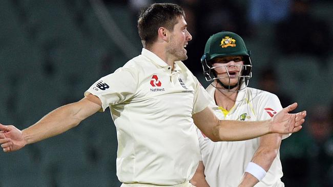 A jubilant Chris Woakes celebrates the prized wicket of Australian captain Steve Smith. Picture: AFP