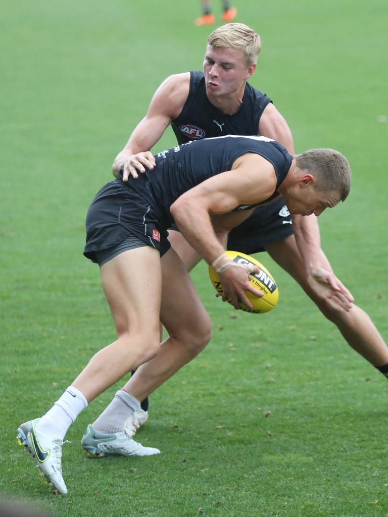 Patrick Cripps is tackled by draftee Harry Lemmey. Picture: David Crosling