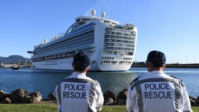 NSW Police Rescue officers look on as the Ruby Princess, with crew only onboard, docks at Port Kembla, Wollongong on April 6.