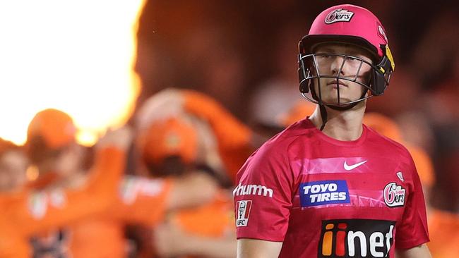 MELBOURNE, AUSTRALIA - JANUARY 28: Hayden Kerr of the Sydney Sixers walks off after he was dismissed during the Men's Big Bash League match between the Perth Scorchers and the Sydney Sixers at Marvel Stadium, on January 28, 2022, in Melbourne, Australia. (Photo by Robert Cianflone/Getty Images)