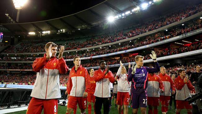 Liverpool players applaud the crowd after a wonderful reception at the MCG.