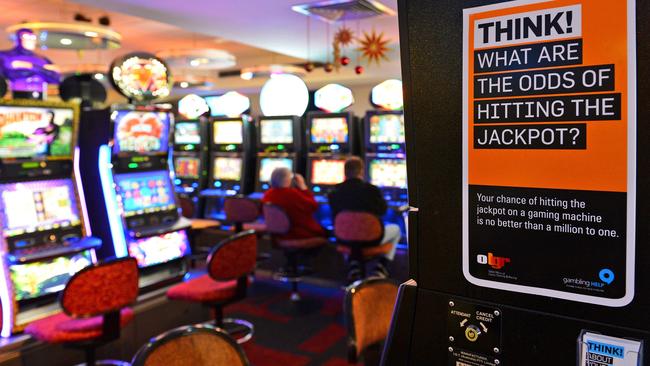 This file photo shows electronic poker machines inside a club. AFP PHOTO / William WEST