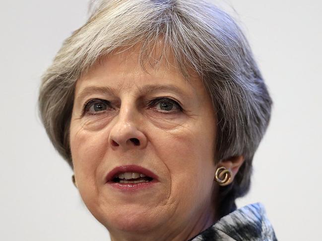 Britain's Prime Minister Theresa May walks to deliver a speech as she opens the Farnborough Airshow, south west of London, on July 16, 2018.  Britain sought to project an image of aerospace prowess long after it leaves the European Union, at the Farnborough airshow on Monday, as Airbus and Boeing announced a raft of deals and issued optimistic outlooks for the global industry. / Getty Images / POOL / Matt Cardy