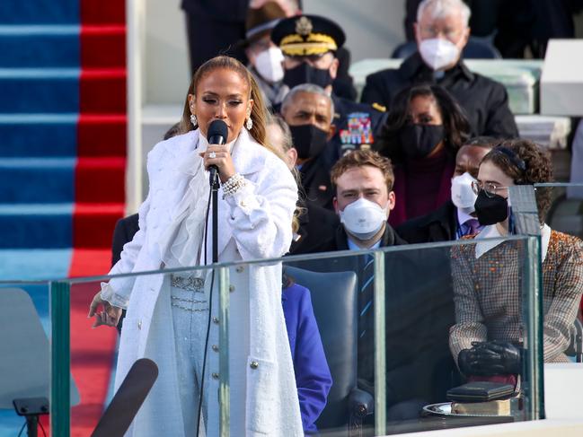 Wearing a white Chanel outfit, Jennifer Lopez sings during the inauguration. Picture: Getty Images