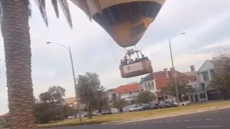 A hot-air balloon travelling at a short height above a Melbourne street made a ‘controlled landing’ according to the pilot. Picture: Instagram