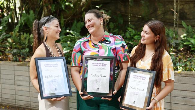 The Cairns Woman of the Year, Young Woman of the Year and the Women's Recognition Award winners have been named at a special event by Cairns Regional Council on International Women's Day. Women's Recognition Award winner Michelle Langford, Woman of the Year Courtney Hansen and Young Woman of the Year Claudia Kurowski with their awards at the Tanks Arts Centre. Picture: Brendan Radke