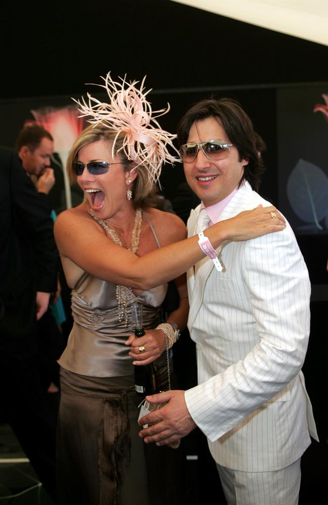 Model &amp; TV host Deborah Hutton with actor Nick Giannopoulos as guests in Moet marquee during Derby Day at Flemington in Melbourne.