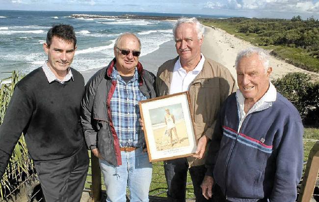 MEMORIES: Captain of the Ballina Lighthouse and Lismore Surf Life Saving Club Andrew Dougherty with veteran lifesavers Richard Crandon, Eoin Johnston and Jack Trevan. Mr Johnston is holding a picture of himself taken in the early 1960s. Picture: Graham Broadhead