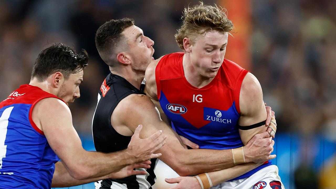 MELBOURNE, AUSTRALIA - SEPTEMBER 07: Daniel McStay of the Magpies is taken high by Jacob van Rooyen of the Demons during the 2023 AFL First Qualifying Final match between the Collingwood Magpies and the Melbourne Demons at Melbourne Cricket Ground on September 07, 2023 in Melbourne, Australia. (Photo by Michael Willson/AFL Photos via Getty Images)