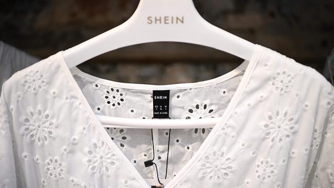 Clothes from online retailers like Shein are often so cheap, young people buy multiple sizes of the same item and simply throw the ones that don’t fit away. Picture: Christophe ARCHAMBAULT / AFP