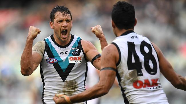 Travis Boak, left, and Lindsay Thomas celebrate a goal against Carlton. Picture: AAP Image/Julian Smith