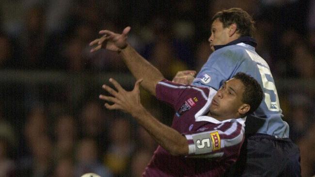 Justin Hodges clashing with Tamana Tahu.