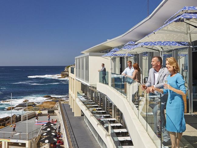 A couple enjoying the views from Icebergs Dining Rooms and Bar, Bondi. Picture: Destination NSW