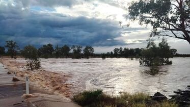 Flooding at Finke River. Residents are warned not to cross. Picture: Nick Ortyan.